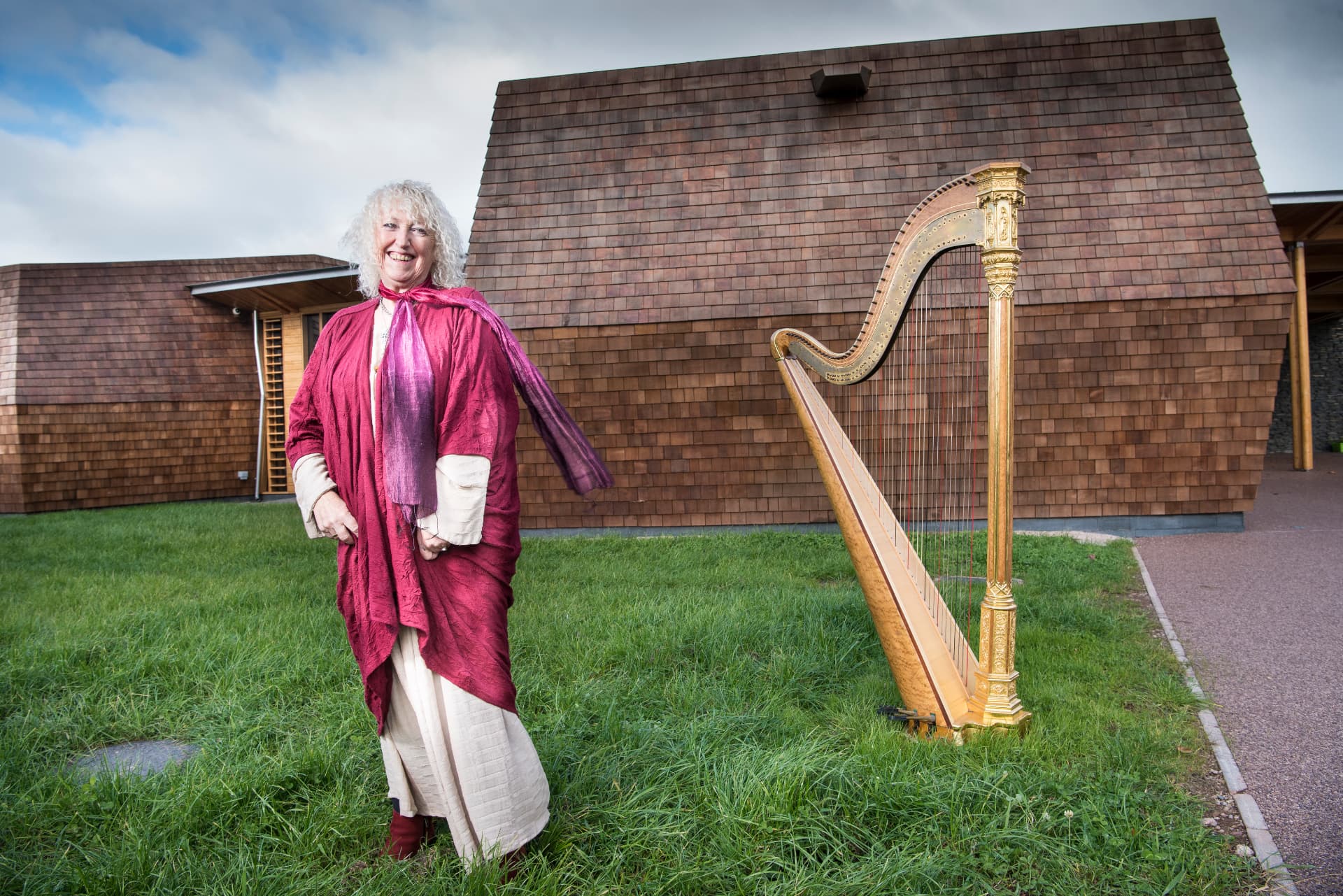 Annie Mawson MBE with her harp outside the Sunbeams Music Centre